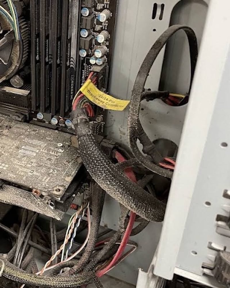 Desktop internals clogged with dust, before service