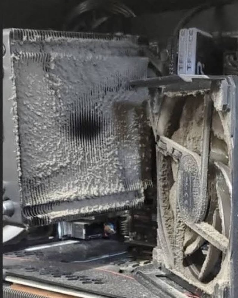 Graphics card fan and heatsink packed with dust, before