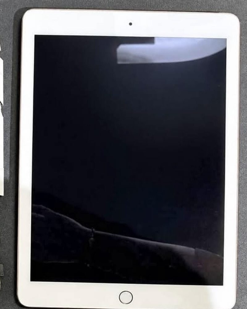 White tablet with new glass, after